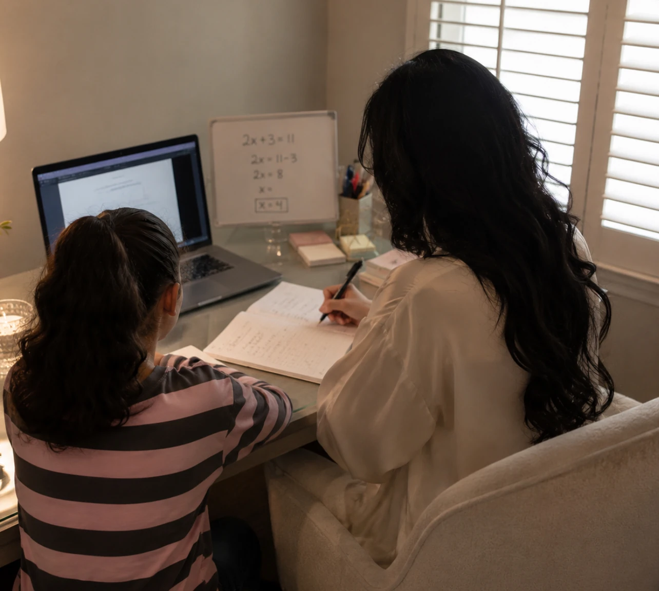 A Noor tutor working with a student